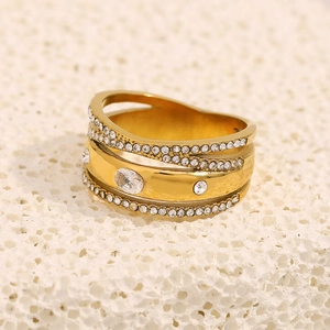 Macro detail of multi-layer 18K gold plated ring with micro-pave zircons and oval stones