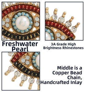 Detailed close-up of retro evil eye brooch with freshwater pearls and sparkling rhinestones