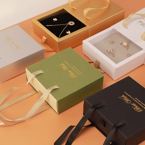 Luxury drawer jewelry gift boxes in multiple colors with gold lettering and ribbon handles