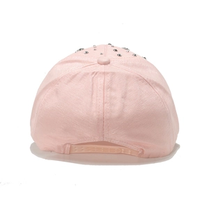 Pink baseball cap back view showing metallic studs and adjustable plastic snapback strap
