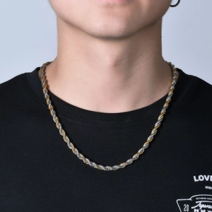 Two-tone stainless steel rope chain necklace on male model wearing black t-shirt