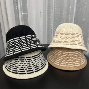 Detail shot of multicolor jacquard knit bucket hats showing texture and pattern details
