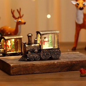 Vintage bronze Christmas train lantern with glowing snowman and LED holiday snow scene