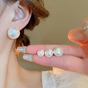 Chic 18k gold plated mermaid pearl stud earrings shown in four various sizes for women