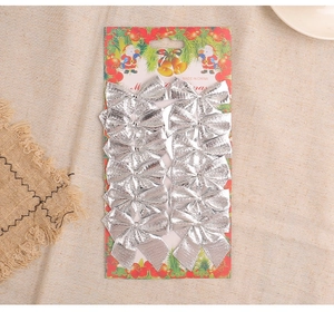 Set of 12 silver Christmas tree bows with metallic glitter finish on display card