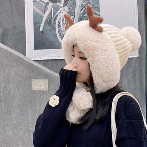 Winter plush trapper hat for women with cute reindeer antlers and earflaps in beige