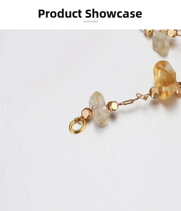 Detail of 18k gold plated stainless steel chain with cube beads and citrine raw stones