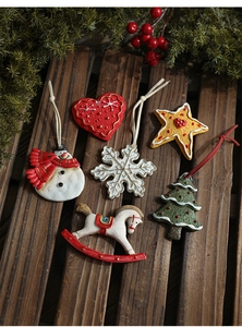Detailed view of six vintage resin Christmas ornaments on a rustic wooden background