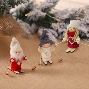Three creative wooden Christmas skiing dolls with knit outfits for tree decoration