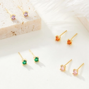 Macro shot of colorful zircon S925 sterling silver stud earrings in gold plating