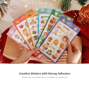 Detailed view of colorful Christmas cartoon stickers featuring Santa and festive motifs