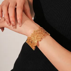 Elegant wide hollow floral gold-plated cuff bracelet featuring clover lace patterns