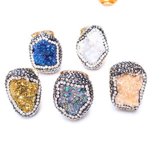 Detailed view of assorted colors crystal druzy rings with gold plating and rhinestones