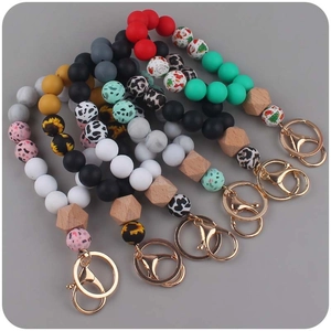 Silicone leopard print and wooden bead bracelet keychain with golden metal clasp ring