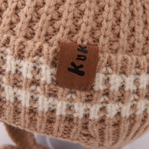 Winter knit baby beanie with faux leather patch and warm khaki textured crochet pattern