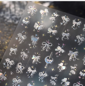 Détails d'autocollants pour ongles avec nœuds et étoiles à effet laser holographique
