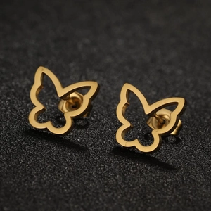 Minimalist hollow butterfly stud earrings in golden stainless steel on dark background