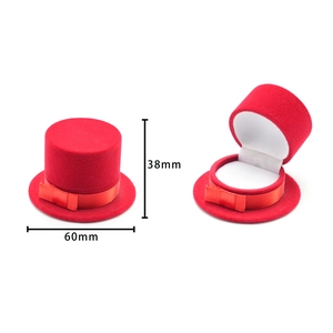 Red hat-shaped velvet ring box with bow ribbon detail and 38x60mm dimensions