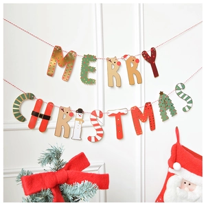 Detail of Merry Christmas letter banner with festive red green gold colors and hanging rope