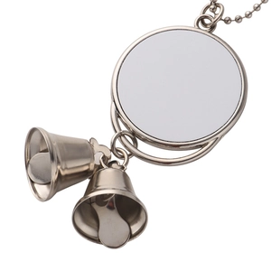 Close-up of blank sublimation metal pendant with silver round plate and two hanging bells