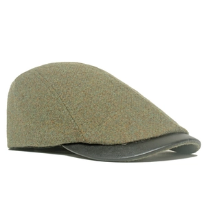 Women's vintage olive tweed flat cap with black leather brim in a side profile view