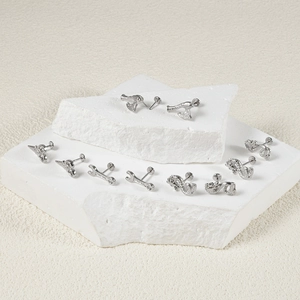 Unique stainless steel dragon and axe push-in labret studs set on white stones