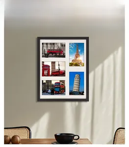 Modern 5-opening black collage photo frame with white matting displayed in a sunlit room