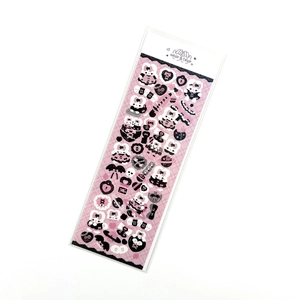 Pink and black gothic style stickers with heart, bow, and cross motifs in clear packaging