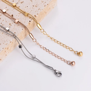Double-layer snake bone chain bracelet with square charms in gold, rose gold and silver