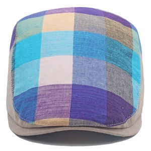 Top view of colorful plaid ivy cap showing multi-color woven texture and stitching