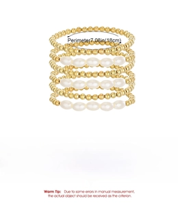 Dettaglio di un set di 6 bracciali elastici con perline dorate e finte perle da 18 cm