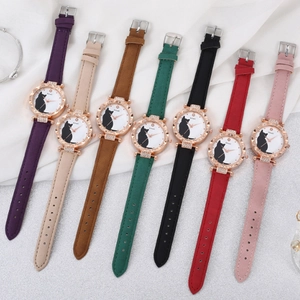 Detail shot of vintage quartz watches with cat pattern dials in seven assorted colors