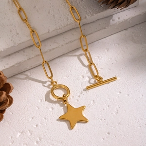 Classic gold stainless steel star pendant necklace with T-bar clasp on white background