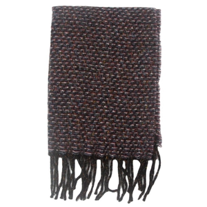 Close-up of a folded dark woven scarf featuring traditional tassel fringe details