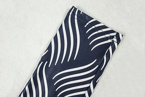 Detailed view of striped wave pattern and high-quality stitching on sleeve cuff