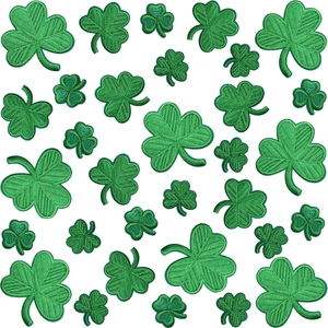 Green shamrock clover embroidered patches in assorted sizes on a clean white background