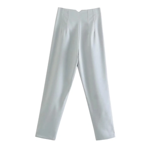 Detail of high waisted straight leg trousers in light grey with vertical decorative seams