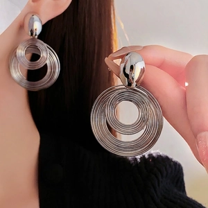 Silver multi-layered concentric hoop earrings with polished oval stud for women