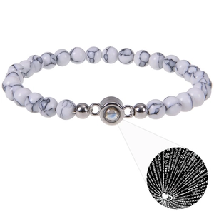 Detail of beaded projection bracelet showing 100 languages I Love You feature