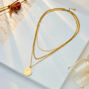 Gold layered necklace featuring snake chain and queen coin pendant for women