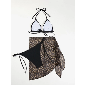 Three-piece bikini set with black halter top, side-tie bottoms and leopard print sarong cover-up