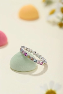 Close-up of S925 silver eternity ring featuring colorful round-cut cubic zirconia stones