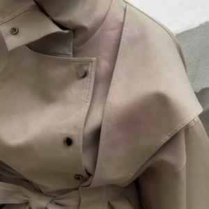 Classic khaki trench coat with stand collar, waist belt, and premium metal snap buttons