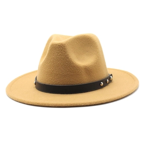 Detail of camel wool fedora with black leather band and silver metallic rivets