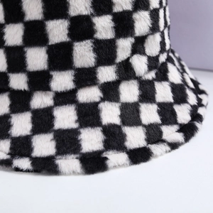Detailed view of black and white checkerboard plush texture and high-quality stitching