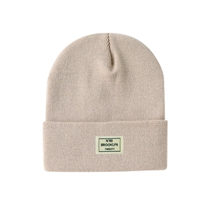 Beige knit beanie with Brooklyn N'86 woven label on cuff for men and women