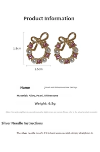Detail view of bow wreath earrings with pink crystals and pearls on gold base