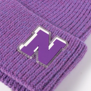 Purple ribbed knit beanie featuring a 3D letter N patch and stylish fold-over cuff
