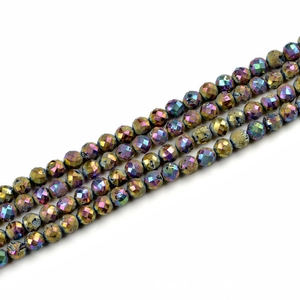 Macro shot of 10mm faceted agate beads with rainbow metallic druzy coating