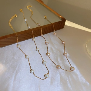 Minimalist gold-plated pearl choker set featuring white pink and purple freshwater pearls
